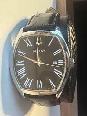 Classic Bulova Black Strap Watch with Silver Caseback